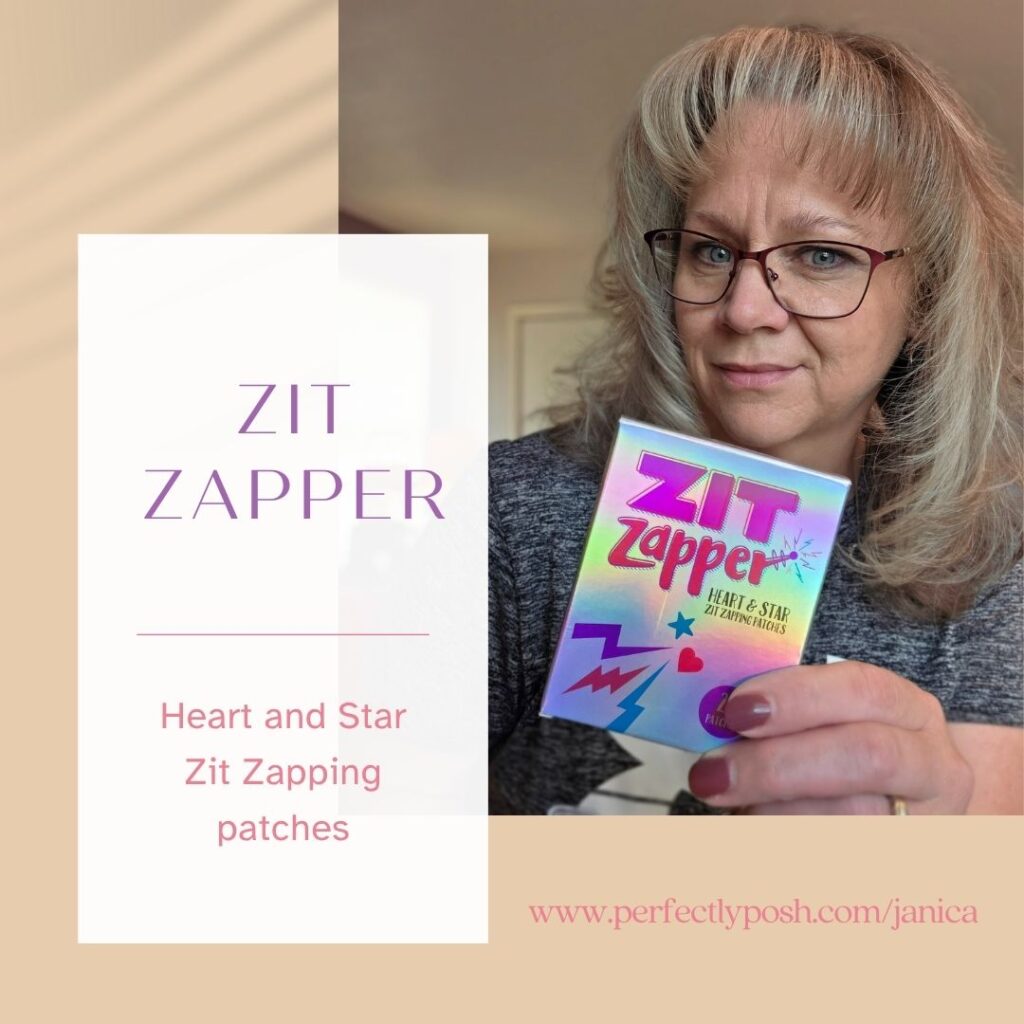 Janica holding a box of Zit Zapper patches from Perfectly Posh. Text overlay reads “Zit Zapper ~ Heart and Star Zit Zapping Patches.” Graphic promotes fun, effective breakout care with cute, colorful pimple patches.